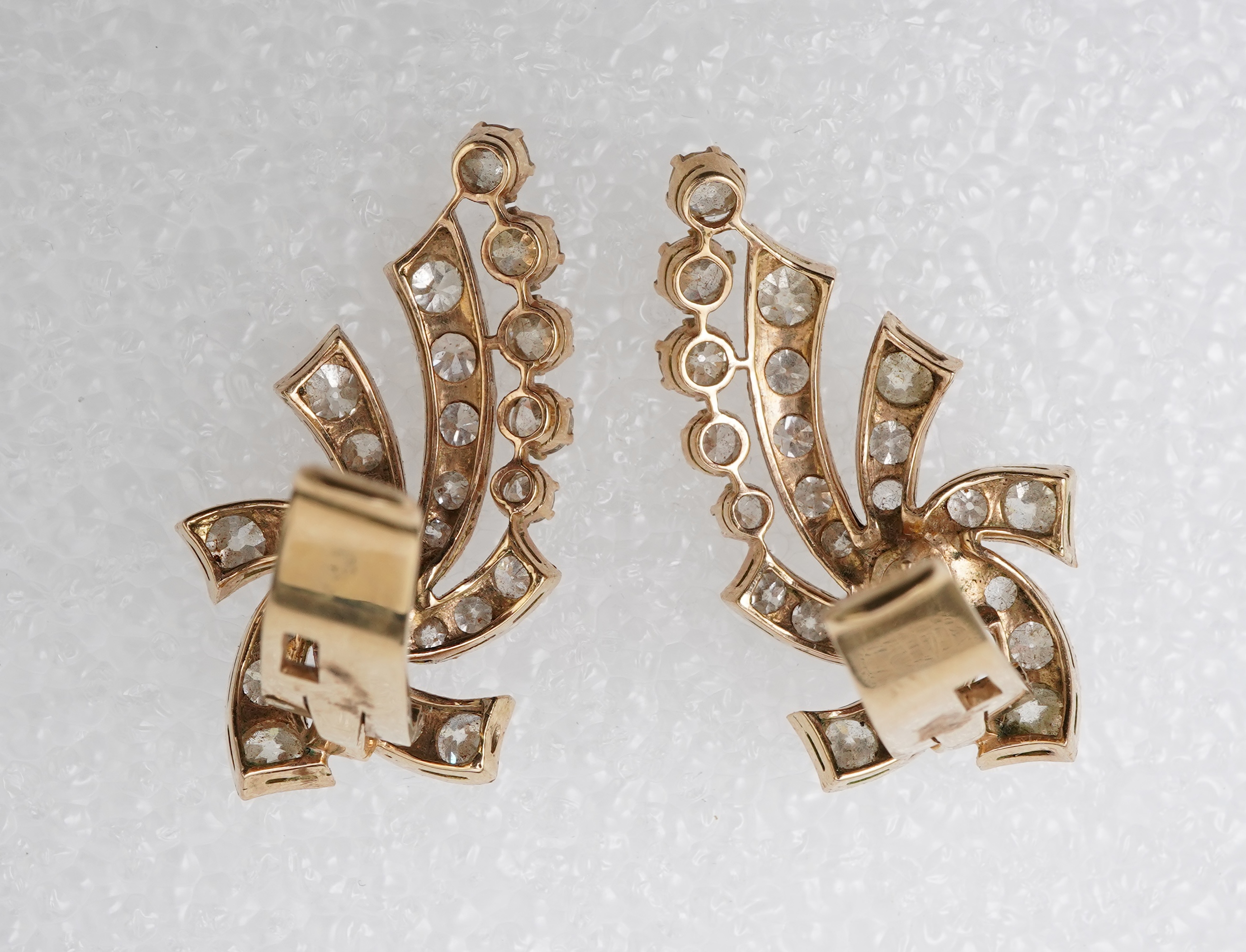 A pair of diamond ear clips, mid 20th century